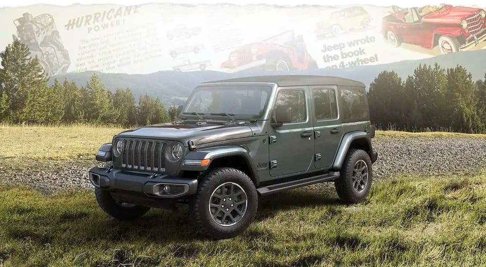 A gray 2021 Jeep Wrangler Unlimited 80th Anniversary edition is parked in a field below a transparent map.