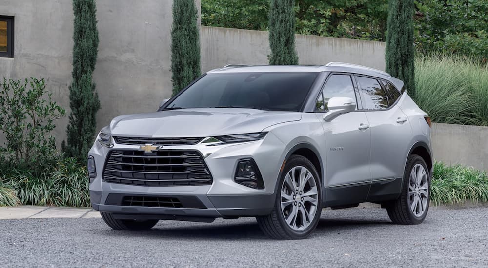 A silver 2022 Chevy Blazer is shown from the front parked in a driveway.