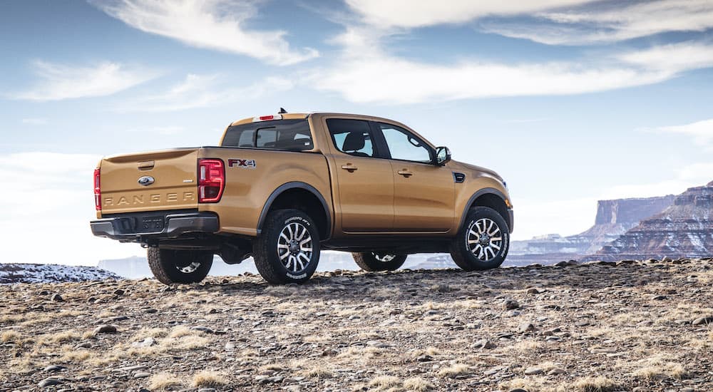 A yellow 2019 Ford Ranger is shown parked in the mountains.