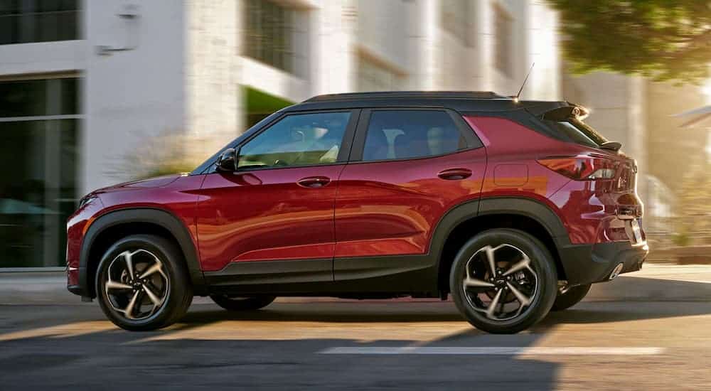 A red 2021 Chevy Trailblazer is shown from the side on a city street.