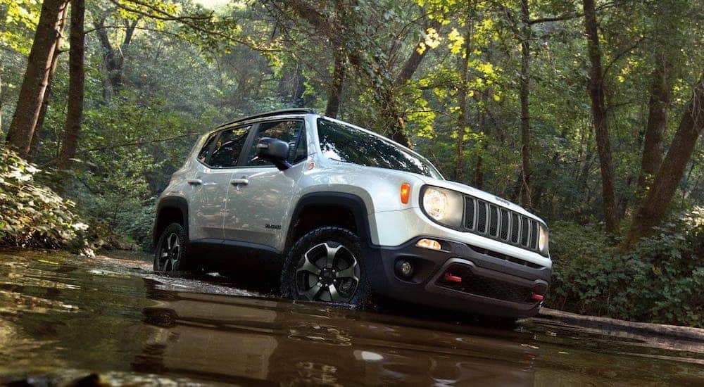 A white 2020 Jeep Renegade is driving in a river after leaving a Jeep dealer in KY.