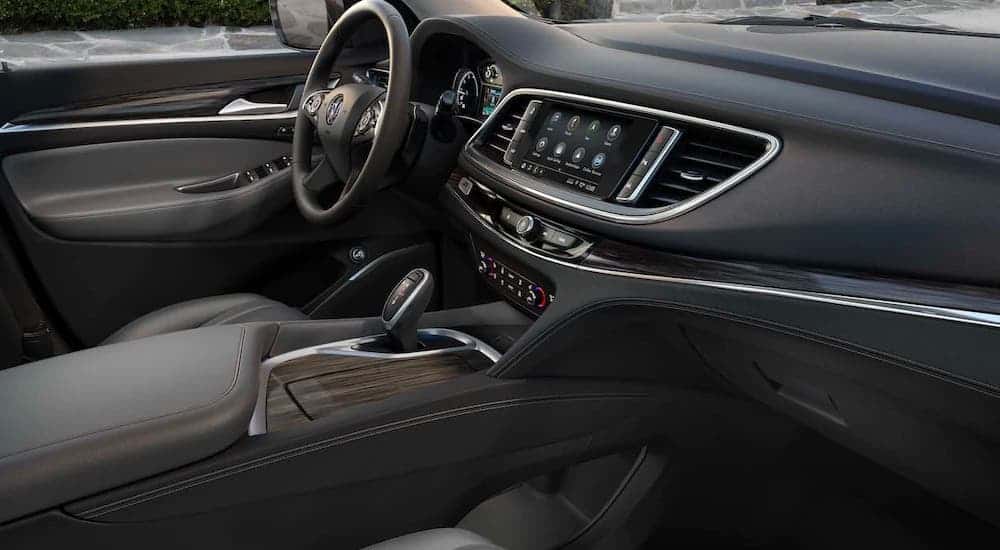 The center console and dashboard are shown from the passenger side in a 2021 Buick Enclave.