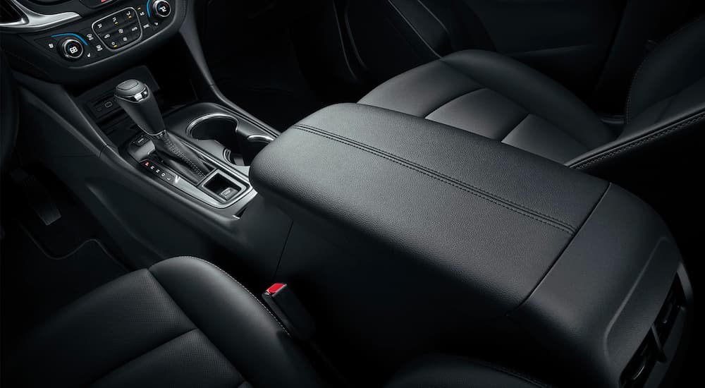 The black seats and center console are shown in a 2021 Chevy Equinox.