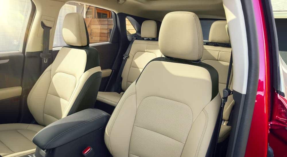 The tan interior is shown from the drivers side on a 2021 Ford Escape Hybrid.