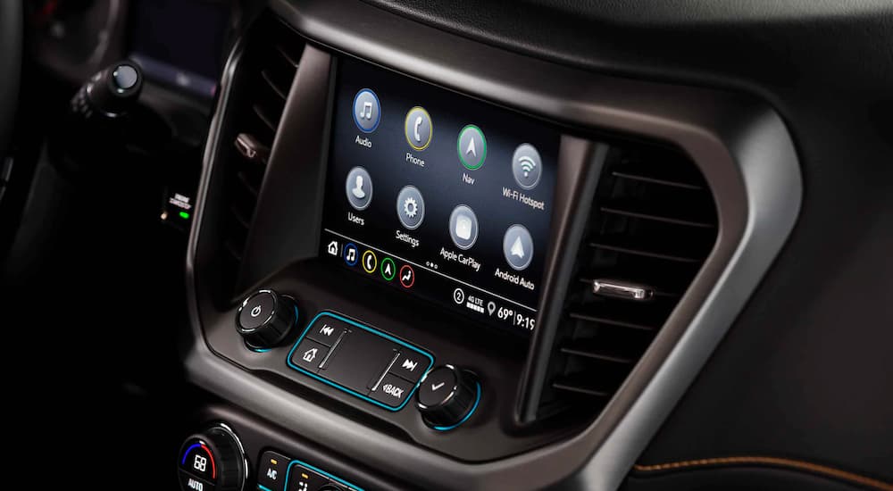 A close up shows the infotainment screen in a 2021 GMC Acadia AT4.