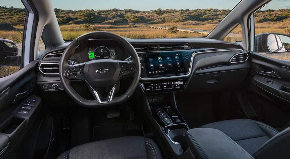 The black interior and dashboard in a 2022 Chevy Bolt EV are shown.