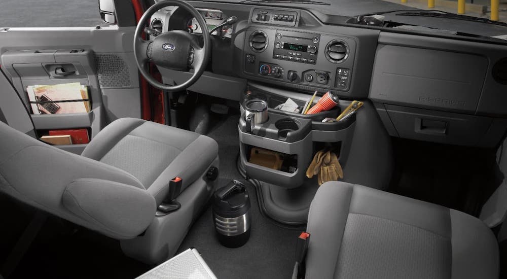 The gray interior and dashboard are shown in a 2022 Ford E-Series Cutaway.