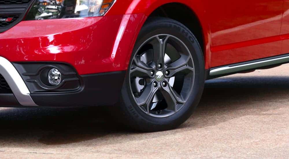 A close up shows the dark gray wheel on a 2020 Dodge Journey.