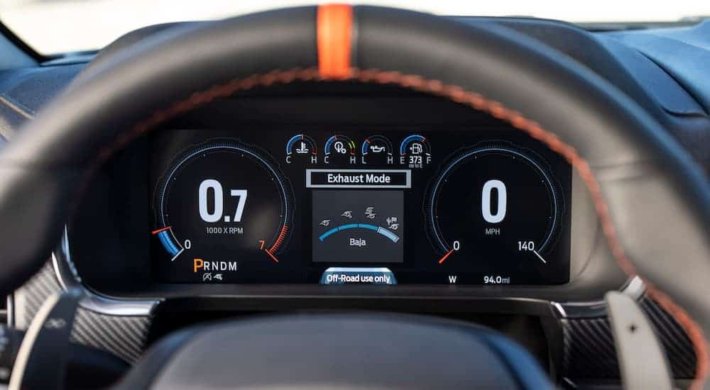A close up shows the instrument cluster in a 2021 Ford F-150 Raptor.