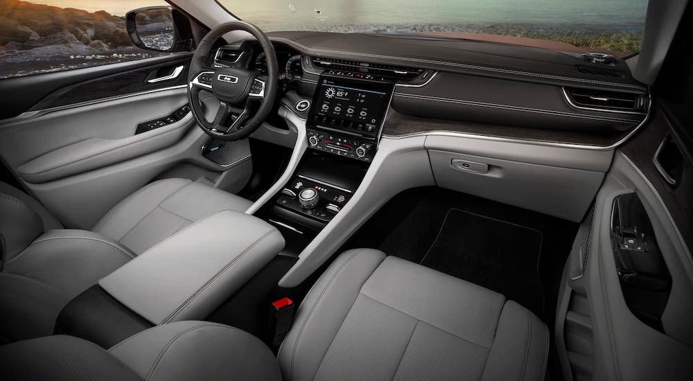 The gray and black interior of a 2021 Jeep Grand Cherokee L is shown.