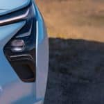 A close up shows the headlight and foglight on a 2022 Chevy Bolt EV.