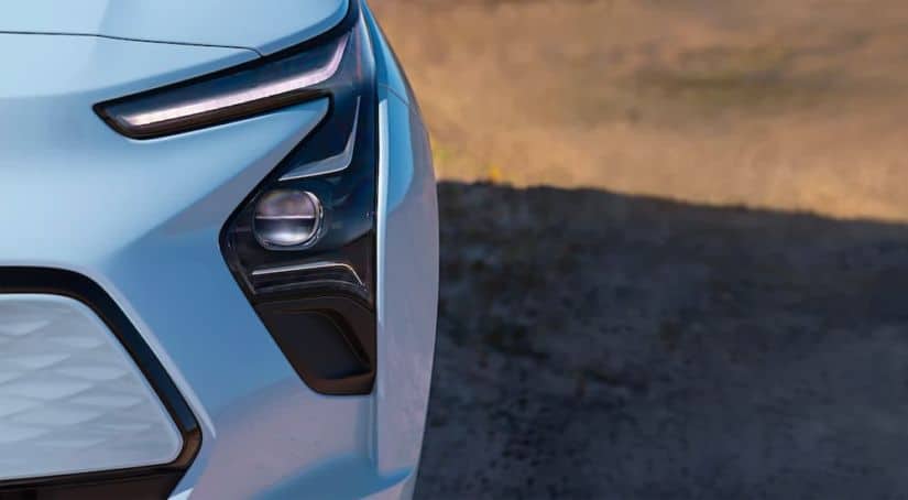 A close up shows the headlight and foglight on a 2022 Chevy Bolt EV.