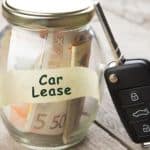 A close up shows a jar full of money labeled car lease.