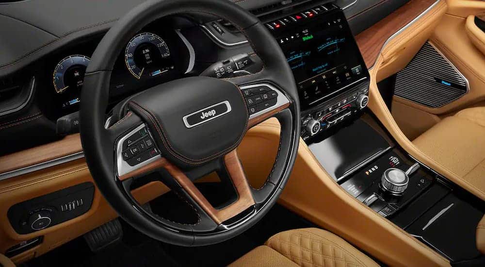 The brown and black interior is shown in a 2021 Jeep Grand Cherokee L.