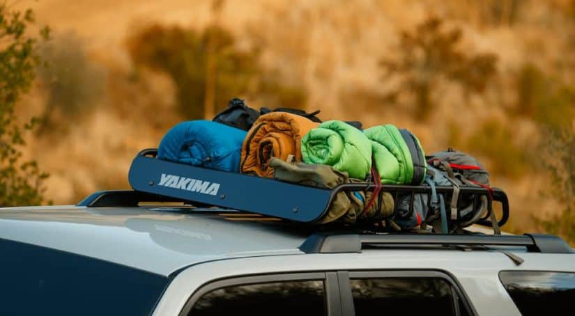 A close up shows sleeping bags loaded on the roof rack of a 2021 Toyota 4Runner TRD Pro.