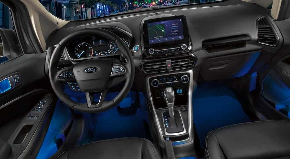 The black interior and dashboard are shown in a 2021 Ford EcoSport.
