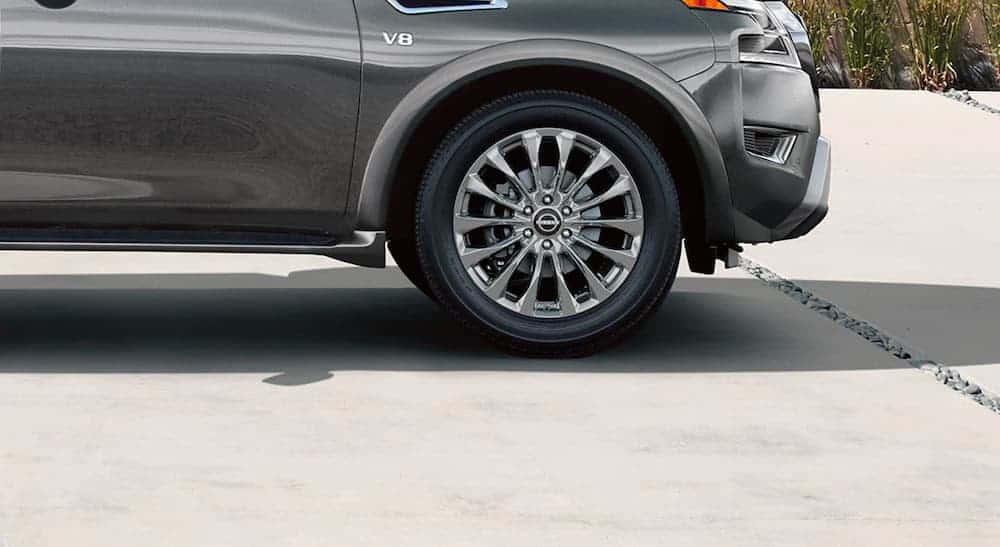 The 22" chrome wheels are shown on a 2021 Nissan Armada Platinum.
