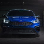 A blue 2021 Kia Forte is shown from the front after leaving a Kia Forte dealer.