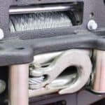A close up shows the front winch on a 2015 used Jeep Wrangler Rubicon.