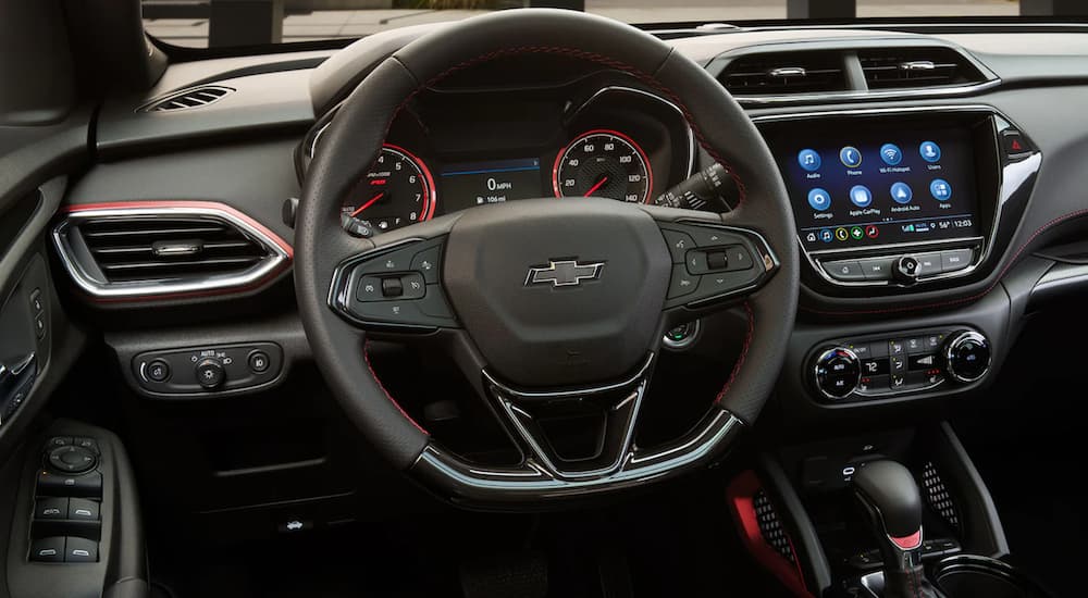 A close up shows the steering wheel and dashboard of a 2021 Chevy Trailblazer.