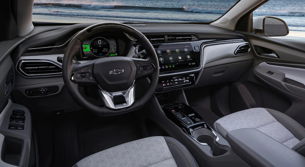 The interior of a 2022 Chevy Bolt EUV shows the steering wheel and infotainment screen.