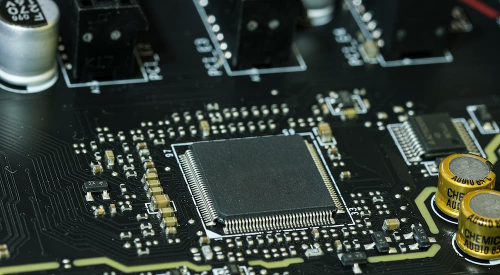 A close up shows a computer chip.