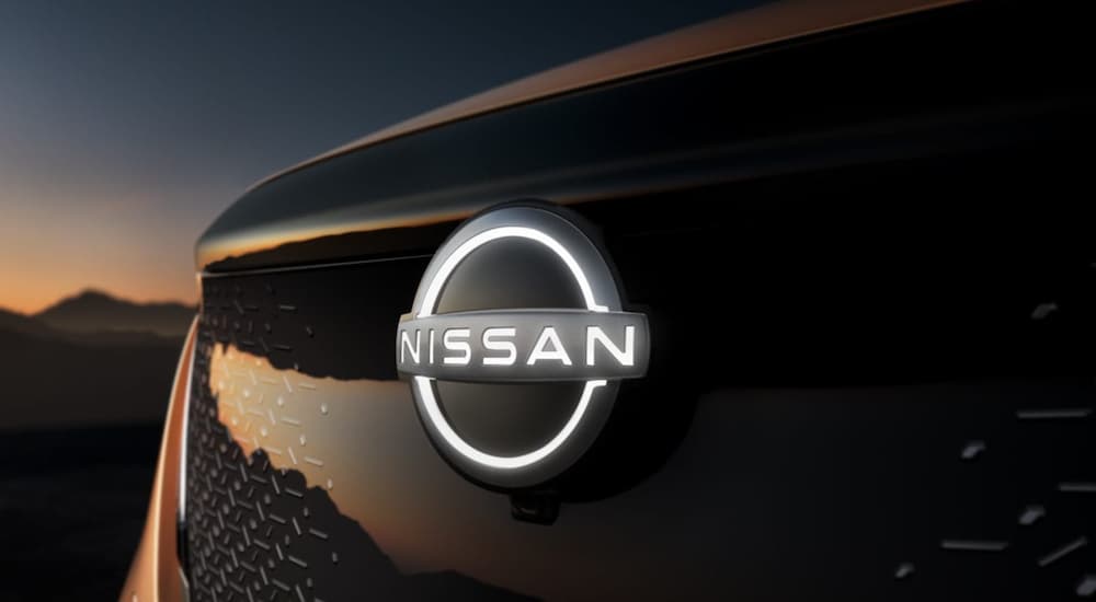 A 2021 Nissan Ariya Emblem is shown at dusk.