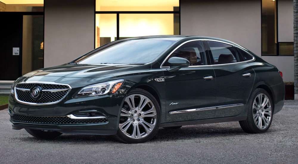 A 2019 Buick Lacrosse is shown from the side parked outside of a house.