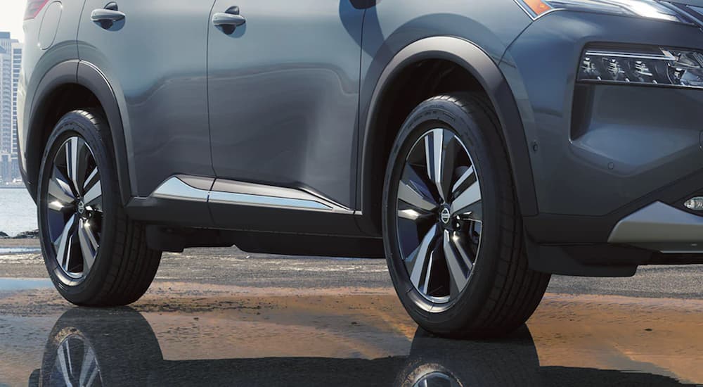 A close shows the wheels on a blue 2021 Nissan Rogue after winning the 2021 Nissan Rogue and 2021 Chevy Equinox comparison.