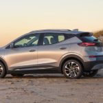 A silver 2022 Chevy Bolt EUV is parked on a beach after winning a 2022 Chevy Bolt EUV vs 2020 Kia Niro EV comparison.