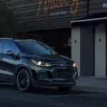 A black 2021 Chevy Trax is parked outside of record store after leaving a Chevy crossover dealer.