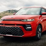 A red 2021 Kia Soul is shown from a left angle after leaving a Kia Soul dealer.