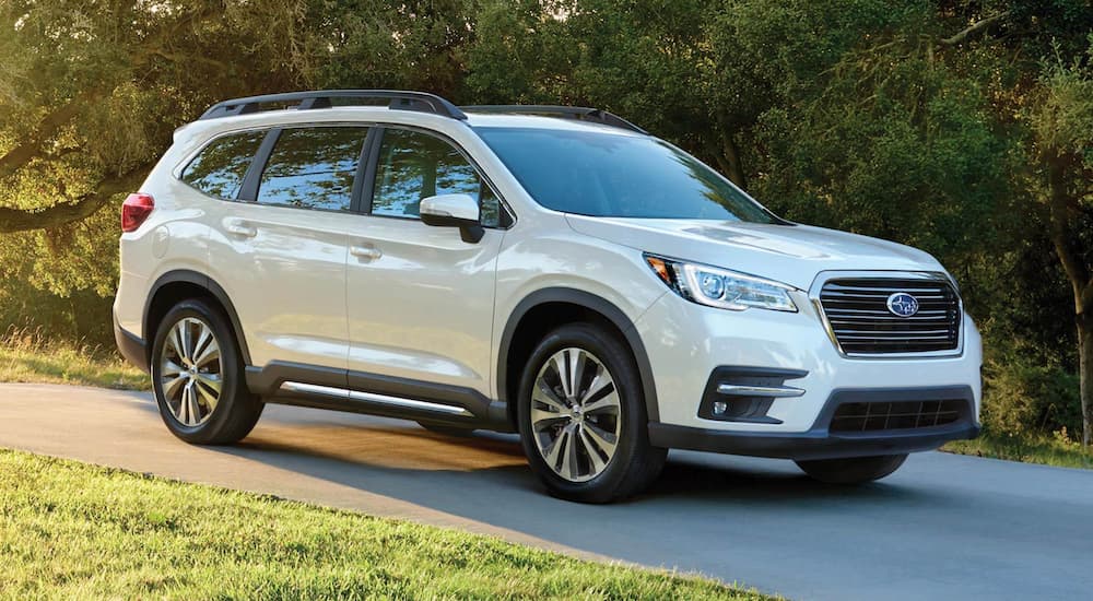 A white 2021 Subaru Ascent Limited is parked in a driveway.