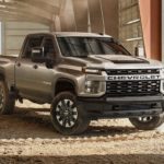 A tan 2022 Chevy Silverado 2500 HD is shown parked after looking at Chevy vehicles in stock.