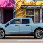 A blue 2022 Ford Maverick is shown parked on a city street after leaving a Ford truck dealer.