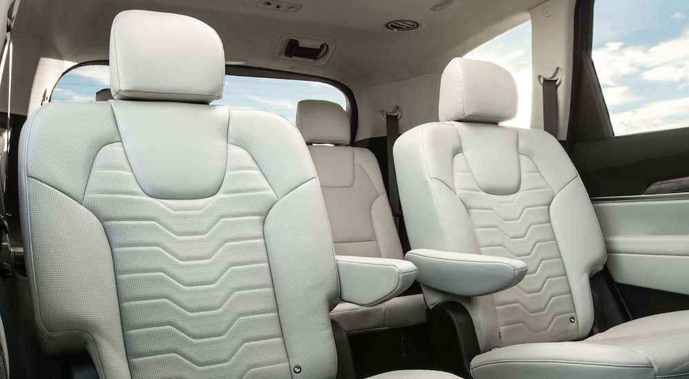 A white interior of a 2021 Kia Telluride shows two rows of seating.