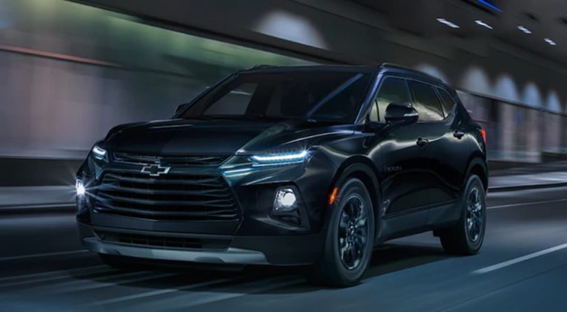 A black 2022 Chevy Blazer is shown from the front driving through a tunnel.