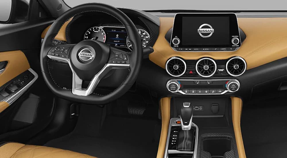 The tan and black interior is shown in a 2021 Nissan Sentra.