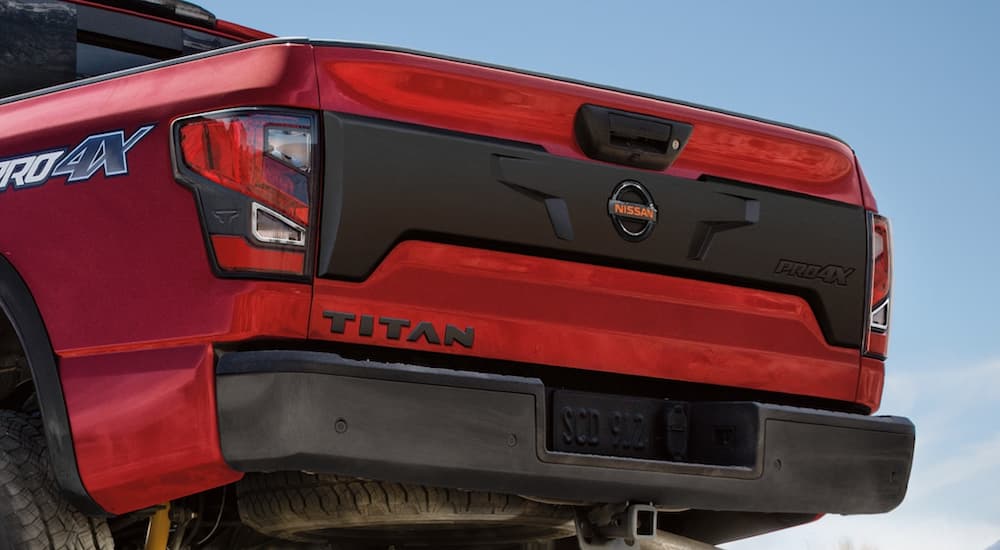 A red 2021 Nissan Titan is shown from the rear after winning a 2021 Nissan Titan vs 2021 Toyota Tundra comparison.