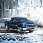 A blue 2022 Chevy Silverado 2500HD parked in a stone quarry.