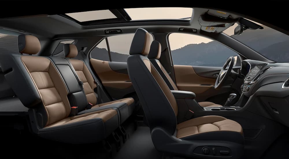 An interior wide shot of a black and tan leather 2022 Equinox RS interior.