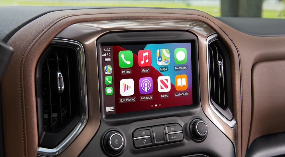 The infotainment screen is shown in 2022 Chevy Silverado 3500HD on a black dashboard with brown accents.