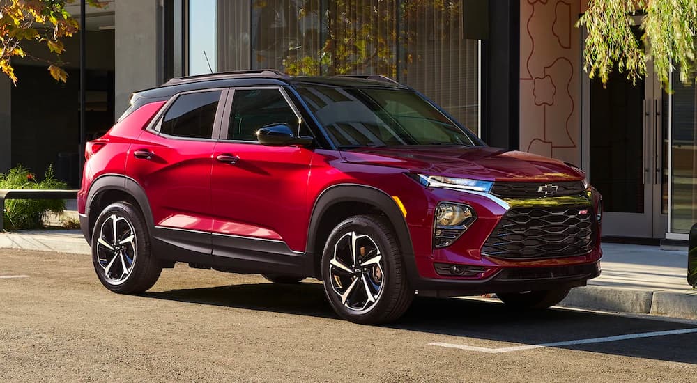A red 2022 Chevy Trailblazer RS is shown parked along a city street.