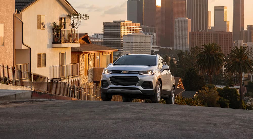 A silver 2022 Chevy Trax is shown leaving the city after a 2022 Chevy Trax vs 2022 Honda HR-V comparison.