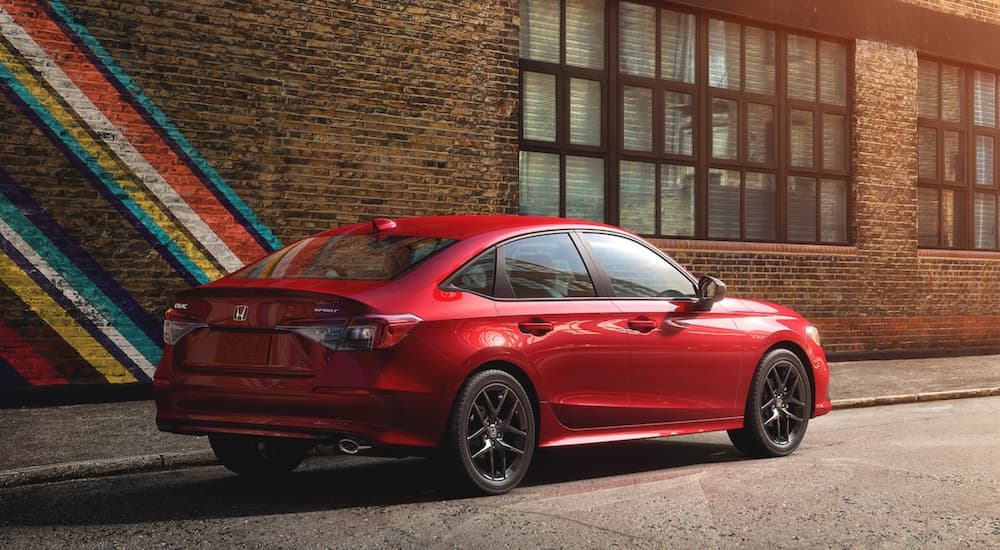 A red 2022 Honda Civic Sport is shown from the side after winning a 2022 Honda Civic vs 2022 Toyota Corolla comparison.