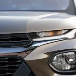 A close up shows the driver side headlight on a tan 2022 Chevy Trailblazer ACTIV.