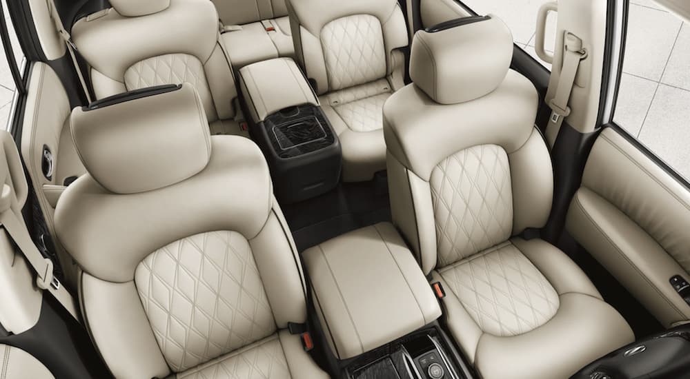 The white interior of a 2022 Nissan Armada shows three rows of seating during a 2022 Nissan Armada vs 2022 Ford Expedition comparison.