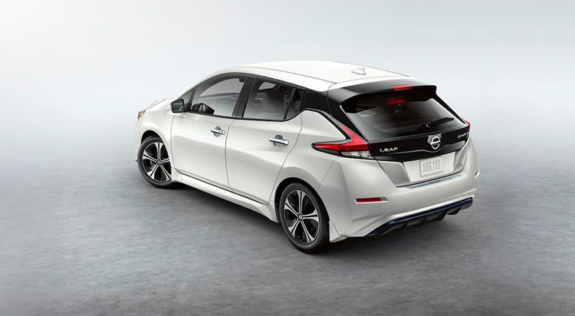 A white 2022 Nissan LEAF is shown from the rear after winning a 2022 Nissan LEAF vs 2022 Chevy Bolt EV comparison.