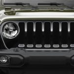 The grille of a 2021 Jeep Wrangler Willy is shown at a Jeep dealer.