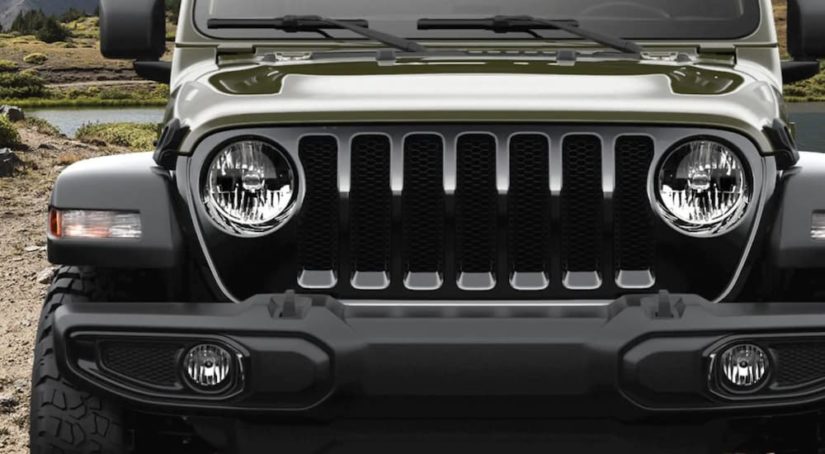 The grille of a 2021 Jeep Wrangler Willy is shown at a Jeep dealer.